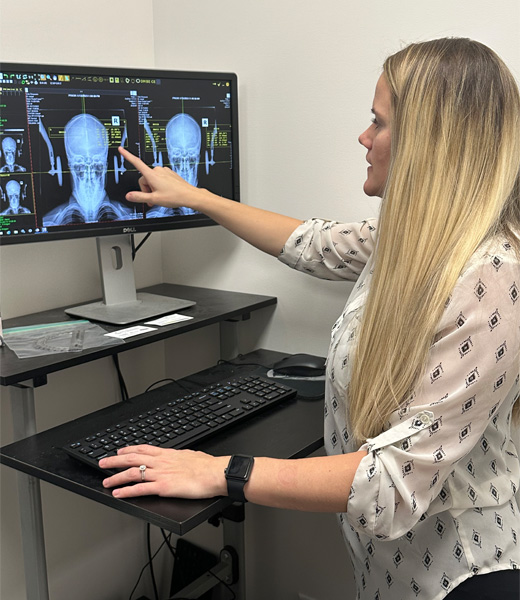 Dr. Danielle Stalp pointing at an x-ray results